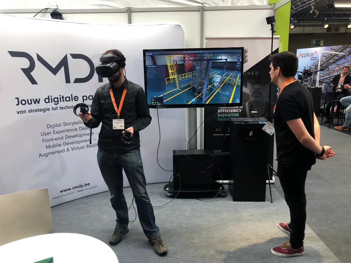 A participant trying Abilitee with a VR headset at an exhibition stand.