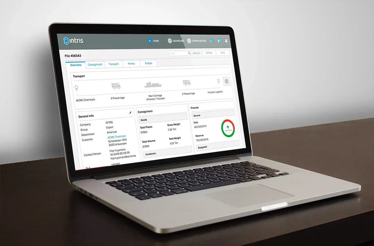 Intris TRIS freight management interface displayed on a laptop.