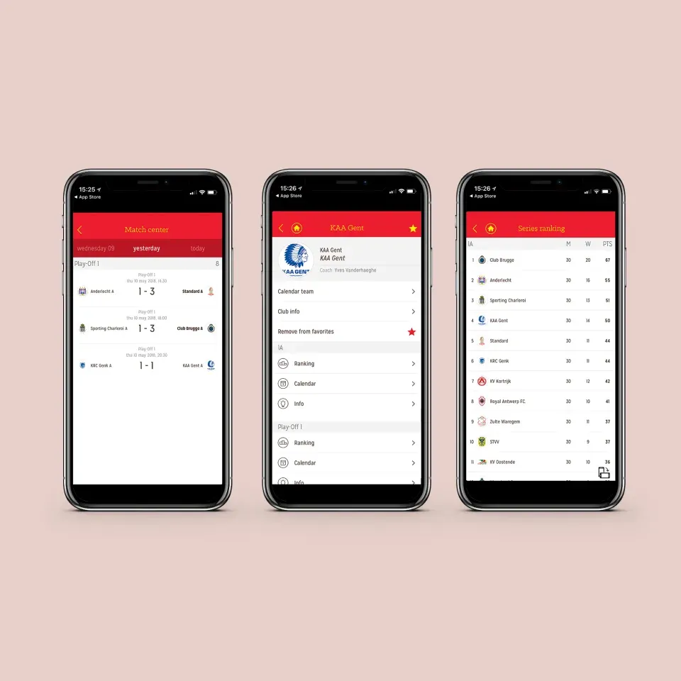 Three phones showing red-and-white Belgian football app screens for match results, club information and fixtures against a pale pink background.