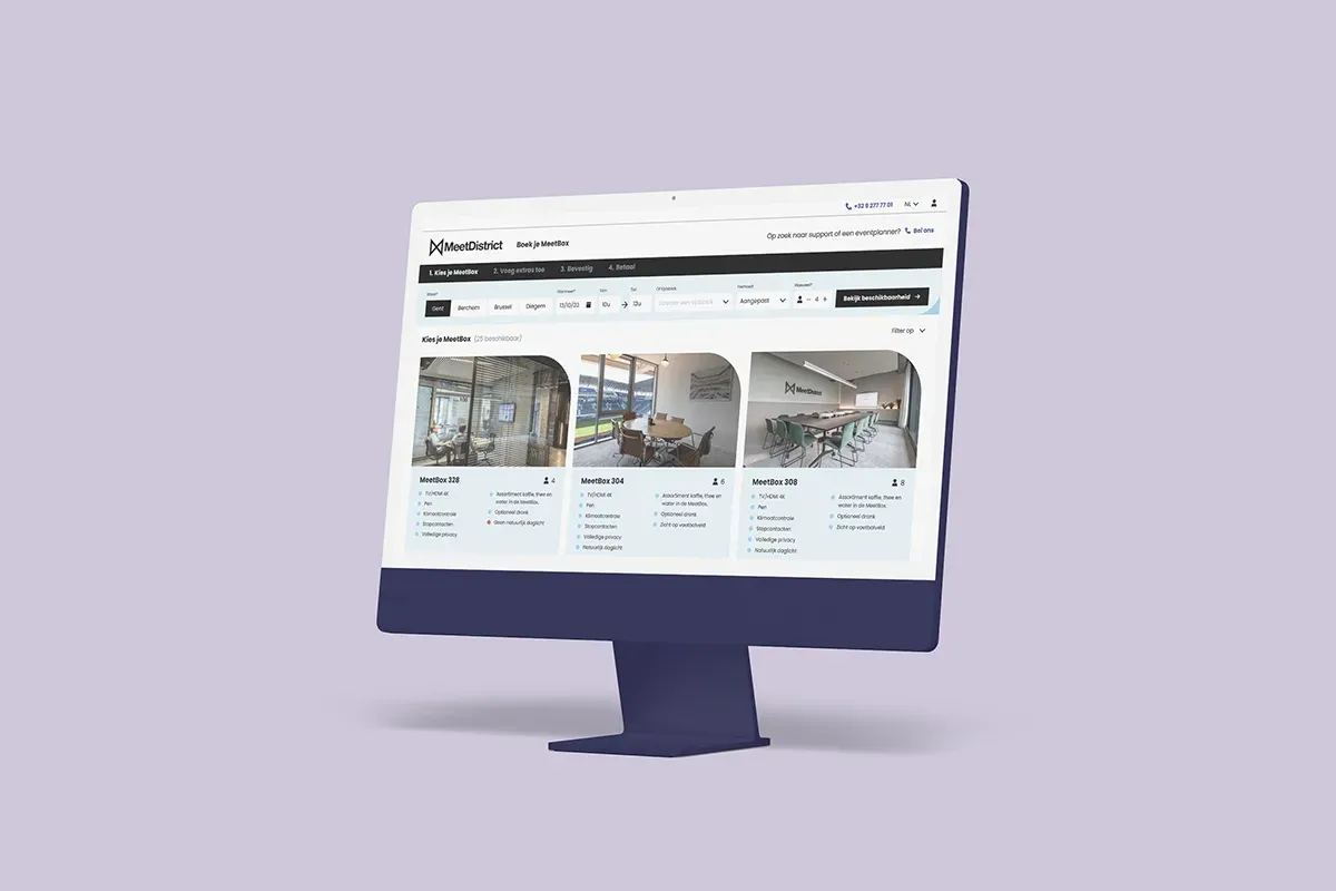 MeetDistrict meeting-room booking interface on a desktop monitor against a pale purple background.