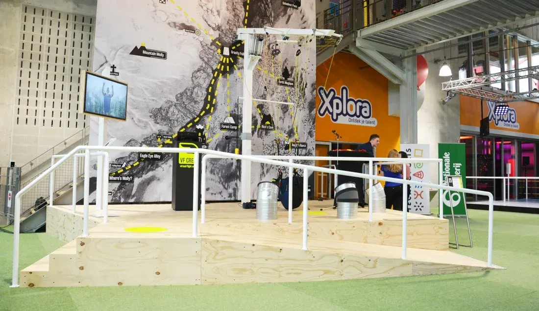 Wide view of the raised Technopolis paragliding installation and its surrounding exhibition space.
