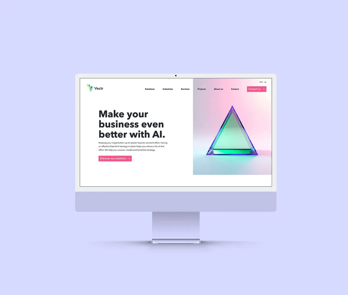 Vectr homepage on a desktop monitor with the headline Make your business even better with AI and a colourful glass prism.